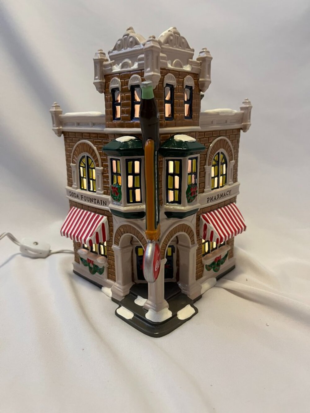 Department 56 Snow Village – Corner Drugstore (Coca‑Cola Brand)